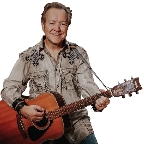 Bobby G. Rice performing with guitar