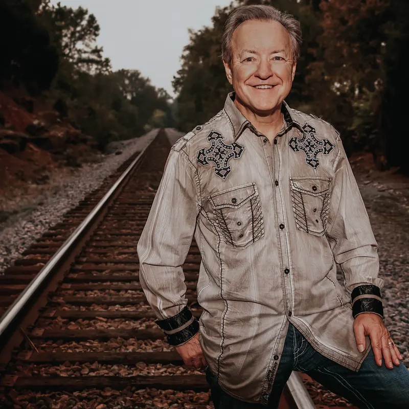 Bobby G. Rice standing between the railroad tracks